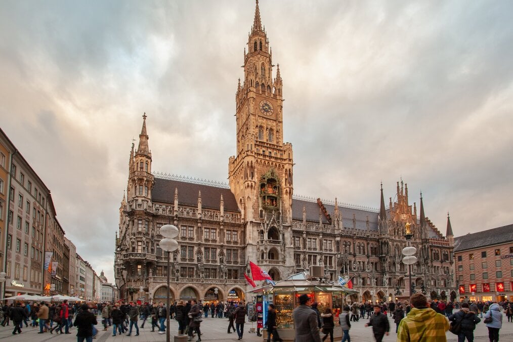 Photo by Sergey Mind on Unsplash An ornate building and crowds of people in Munich, Germany.