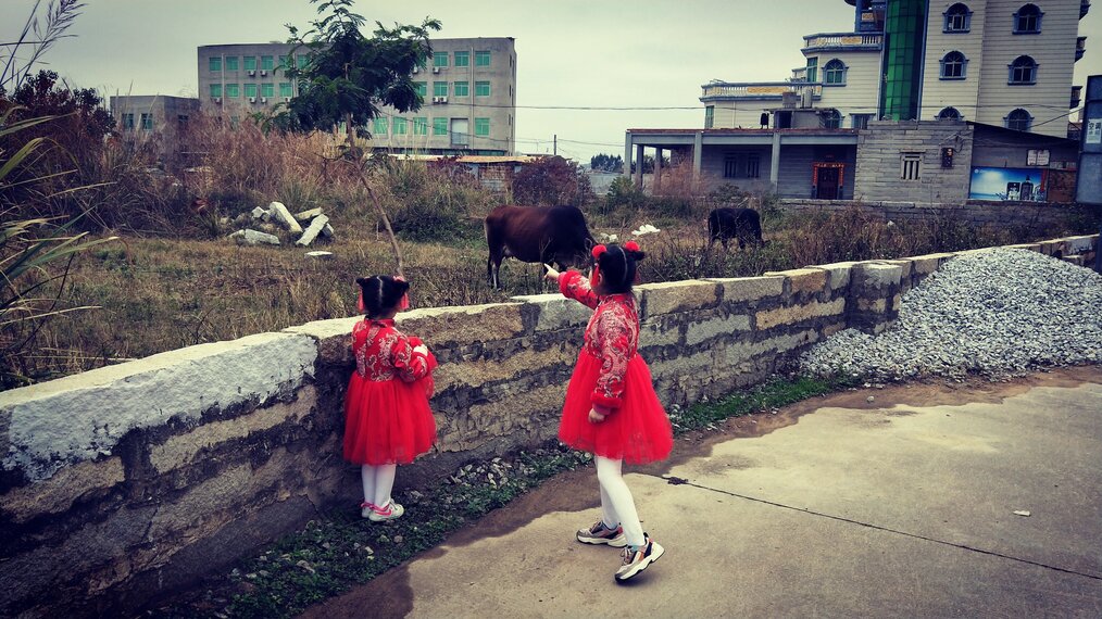 Two young girls in traditional dress.
