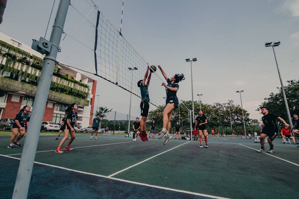 People playing volleyball.
