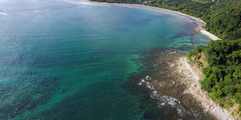 Blue water and the coastline along Samara beach.