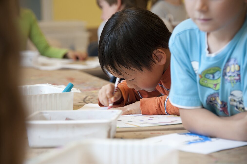 Student writing in class