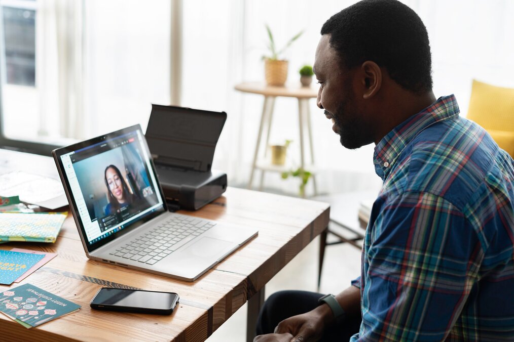 Person meeting with someone virtually for a video call