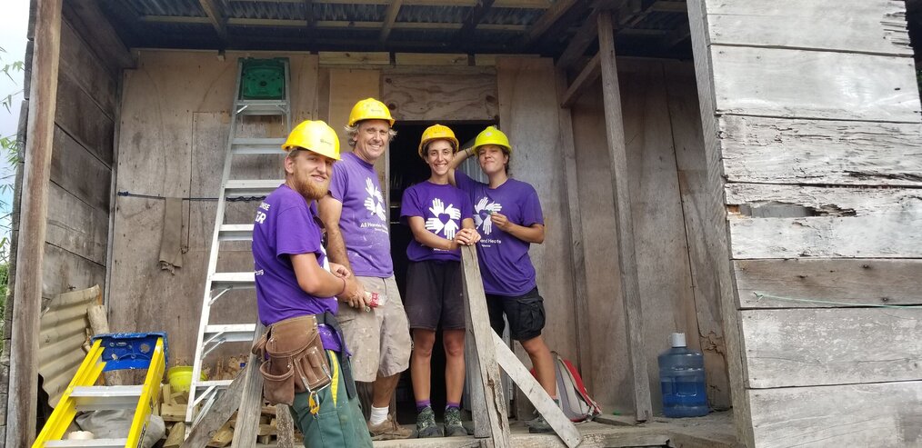 Dan, All Hands and Heart Dominica Group of smiling volunteers doing construction