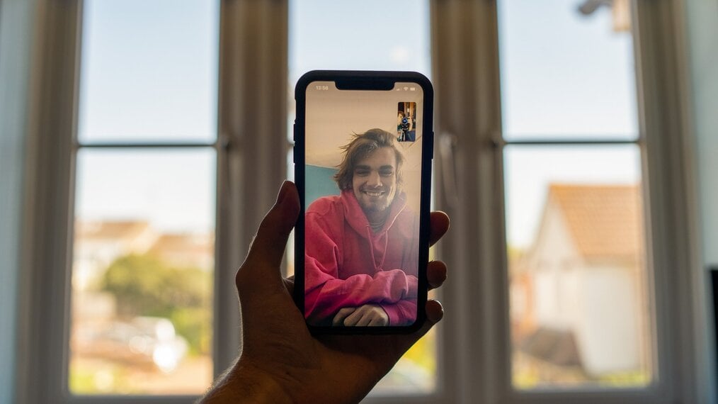 Photo by Ben Collins on Unsplash Someone doing a video chat on a cell phone.