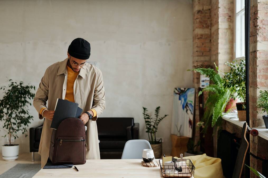 Person packing up backpack