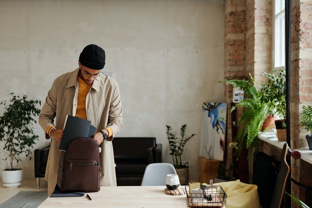 Person packing Person packing up backpack