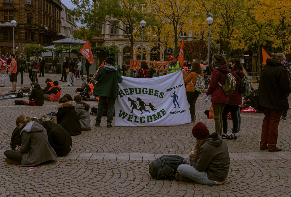 Photo by Folco Masi on Unsplash Pro-refugee protesters gather in Germany.