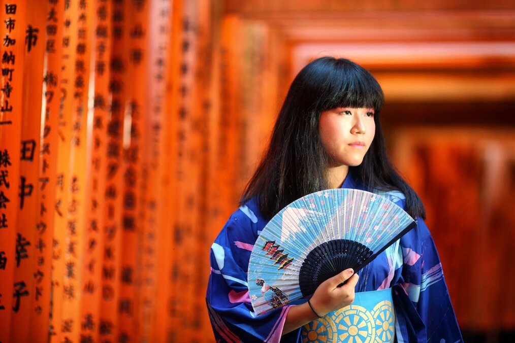 Gina Li, Travel for Teens Japan Girl holding Japanese-style fan