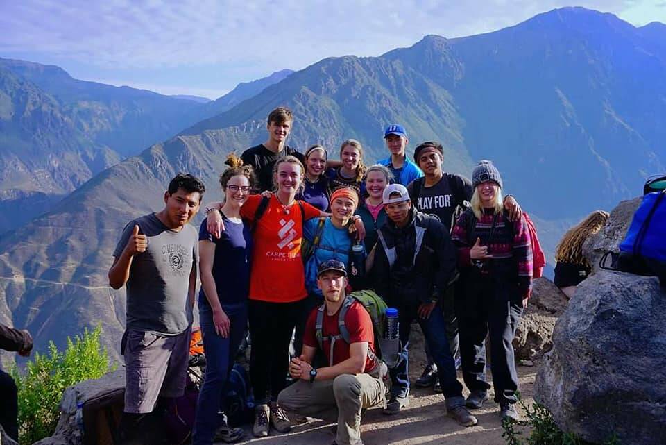 Group of volunteers standing on mountain