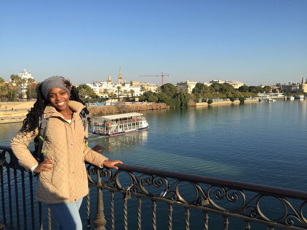 Traveler standing on bridge over water