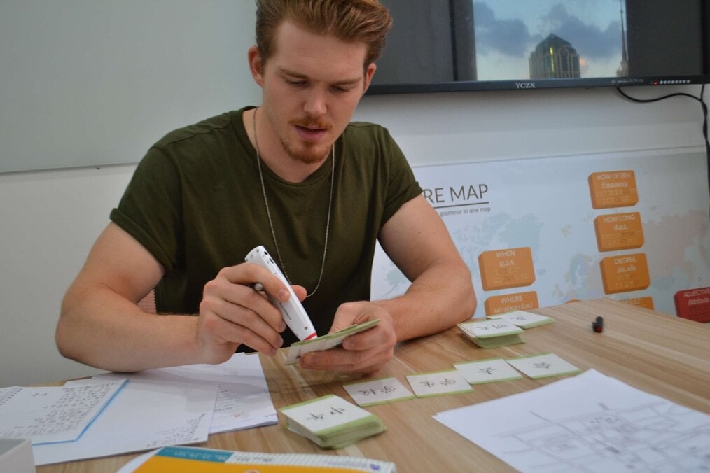 Jonas, Silk Mandarin Language Training Institute China Teacher gluing classroom materials and making flash cards