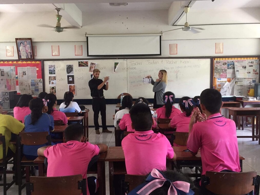 Two teachers leading a classroom in Thailand