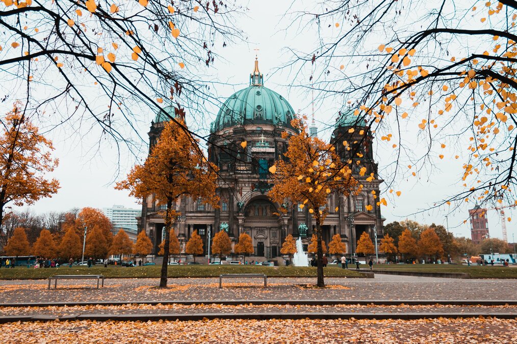 Building in Berlin with batch of orange trees in front