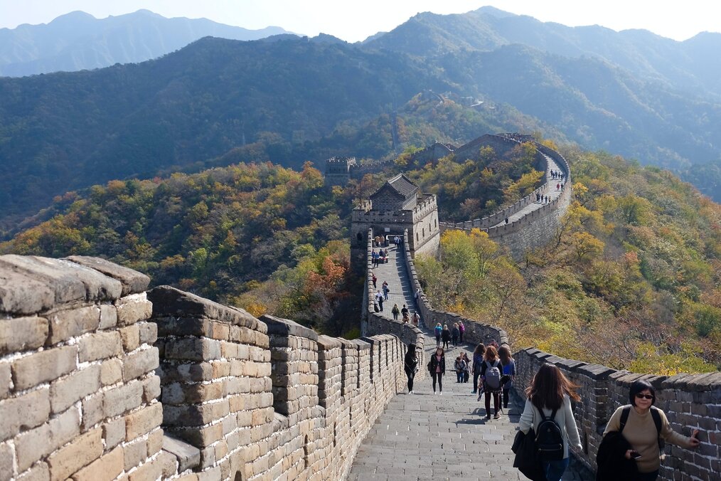 Travelers walking down the Great Wall of China