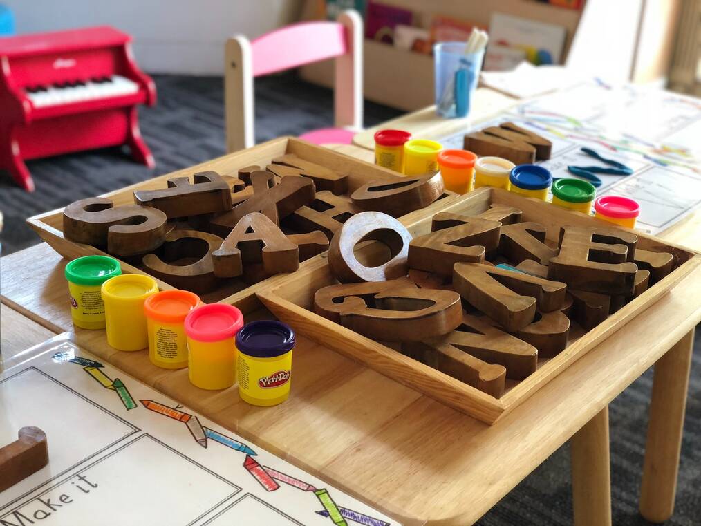 Wooden letters on a desk.