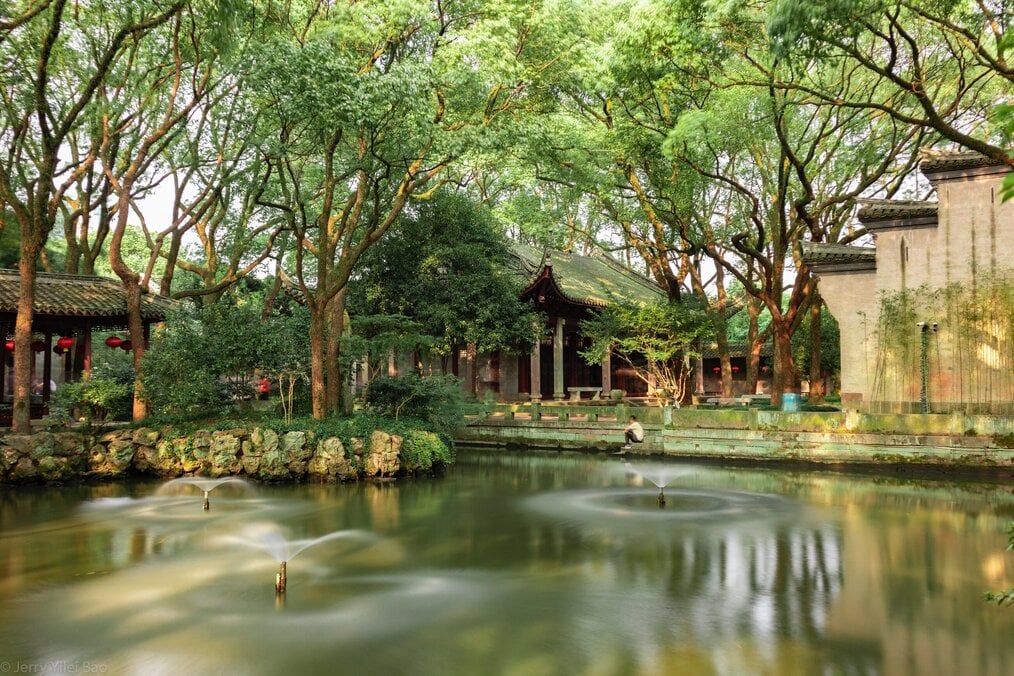 Photo by Jerry Bao on Unsplash Buildings near a pond in Ningbo, China.