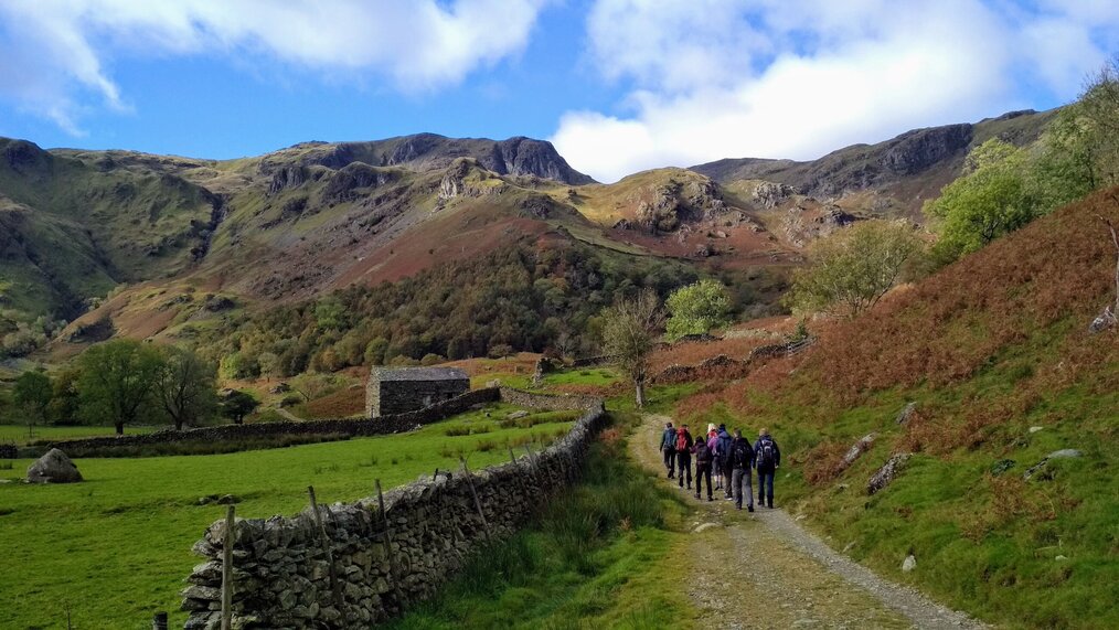 A group of people hiking in the Lake District in England.
