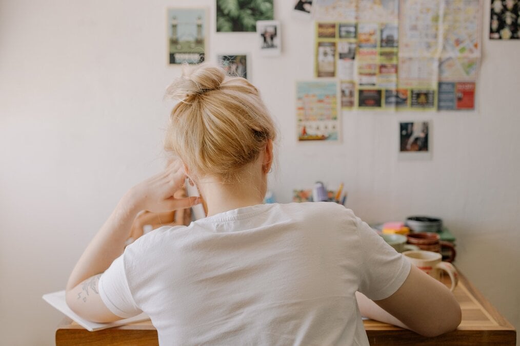 How to Study Abroad with a Low GPA, Courtesy of Pexels girl sitting at desk studying