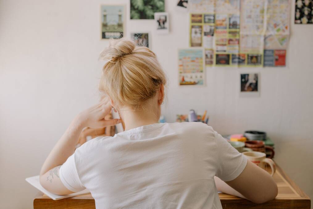 girl sitting at desk studying 