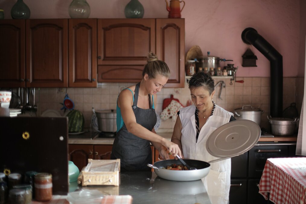 Image courtesy of Andrea Piacquadio, Pexels A student cooking with a homestay host