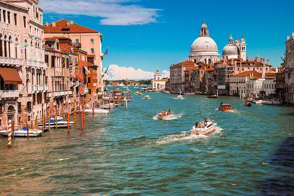 A boat on a river in Italy