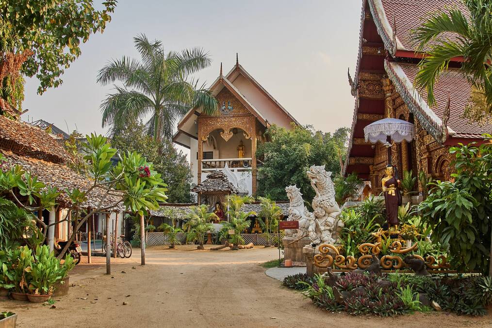 An outdoor courtyard of a temple in Thailand.