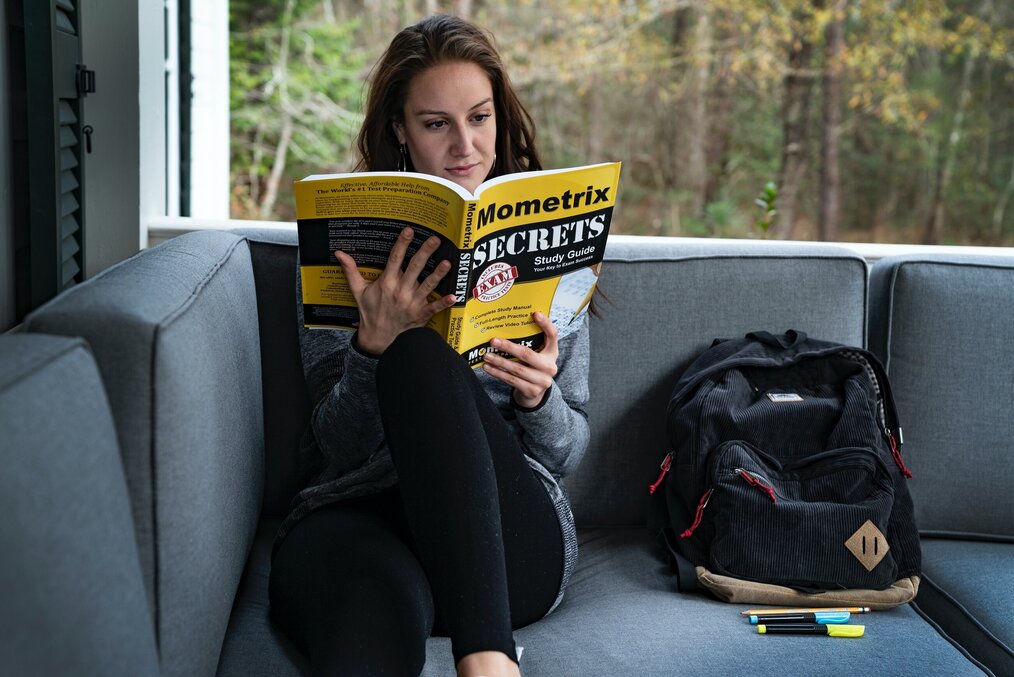 Photo by Mometrix Test Prep on Unsplash A woman reading a test prep book.