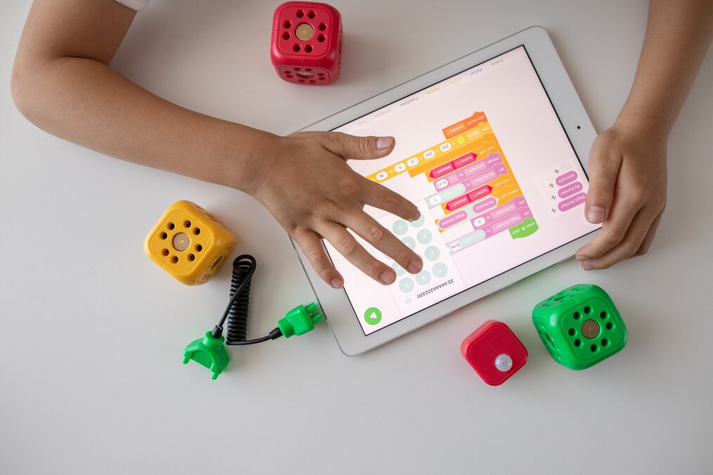 Photo by Robo Wunderkind on Unsplash A child's hand touching a tablet.