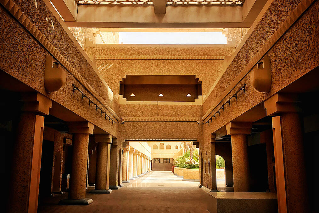 A hallway with columns on each side