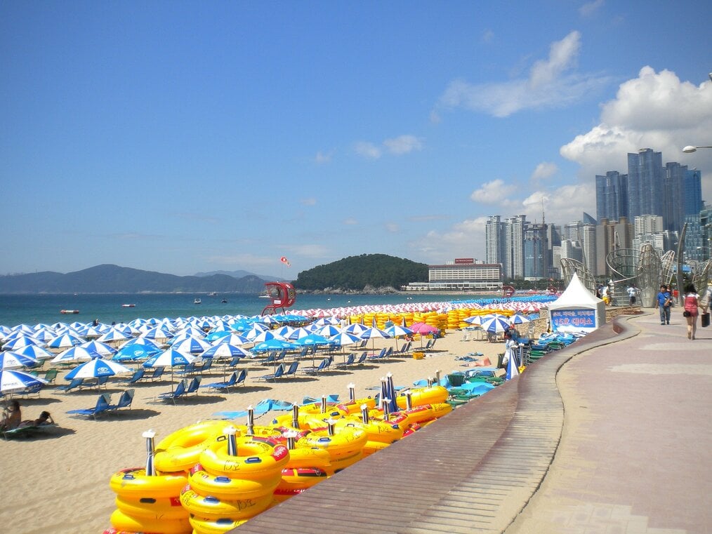 Picture by guesschoi on Pixabay Umbrellas on a beach in Busan, South Korea.