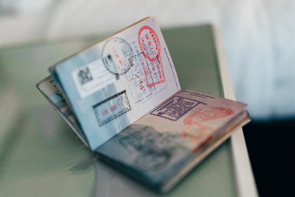 Image curtesy of Convert Kit, Unsplash A passport with a lot of stamps