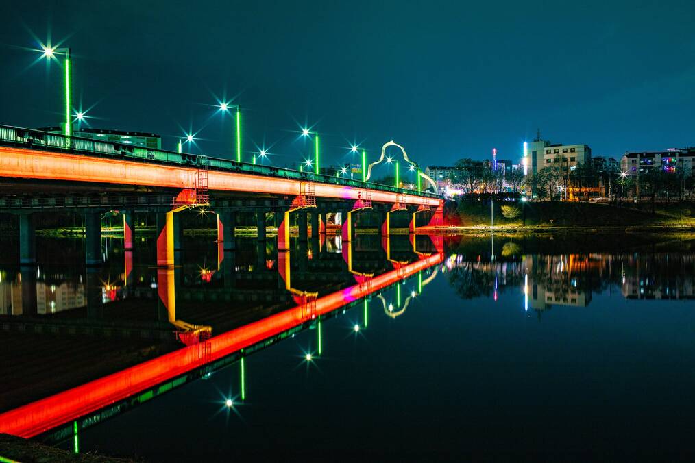 A brightly lit bridge at night in Daegu, South Korea.