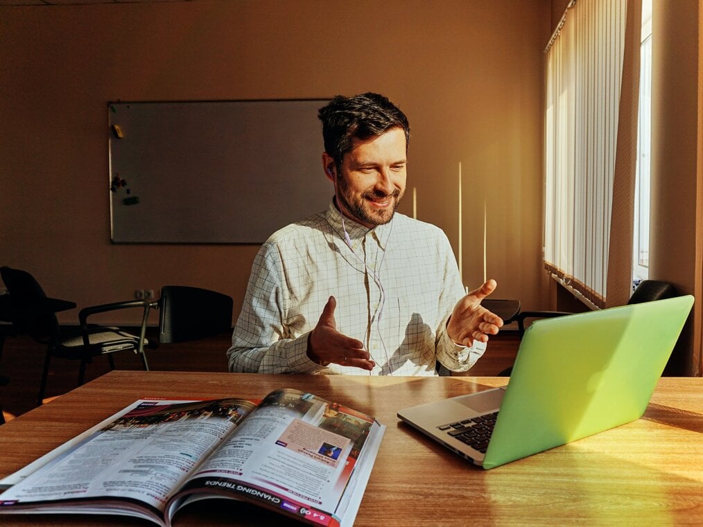 Image curtesy of Anastasiia Kamil, Unsplash An online ESL teacher giving a lesson on his laptop