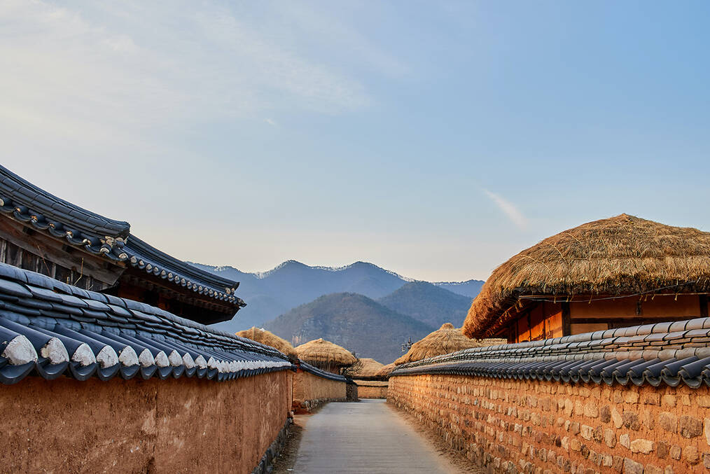 A view of houses with mountains in the background in the small town of Andong