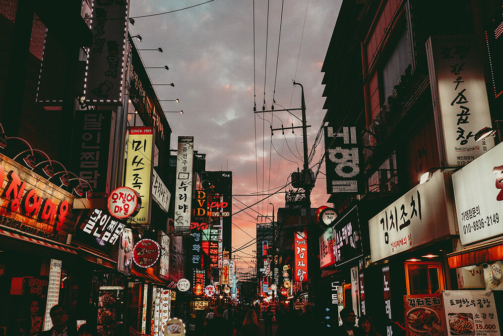 A street view of Seoul with many signs written in Korean