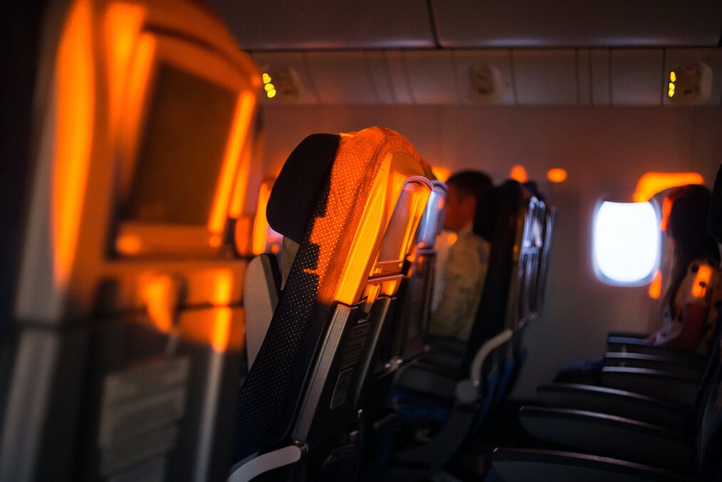 Sunset lighting up seats in a commercial plane