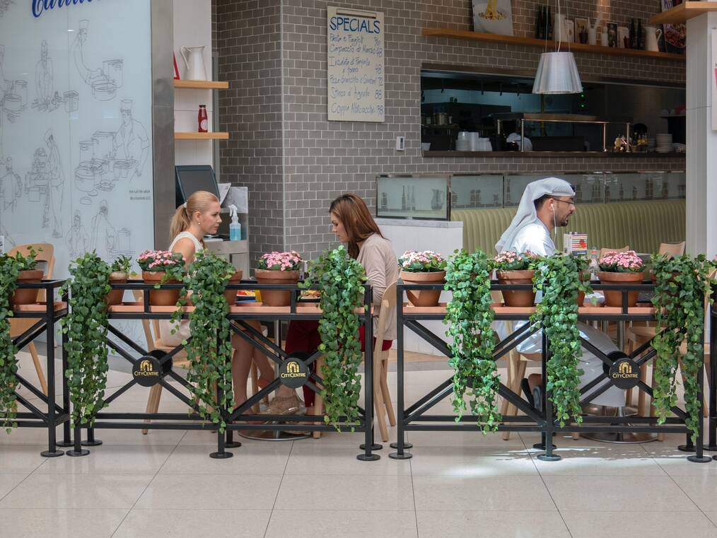 Two teachers having lunch at a cafe in Dubai