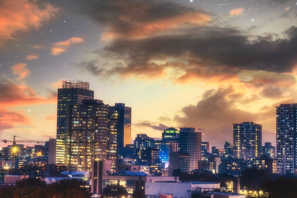 A purple and yellow city landscape of Johannesburg skyline