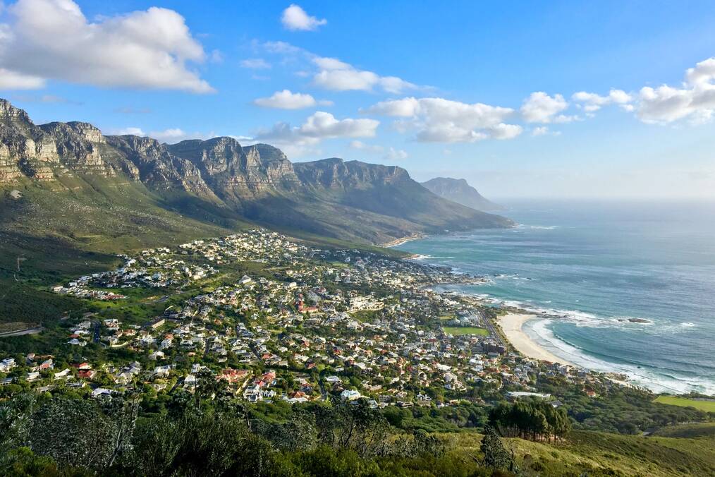 A view of the coastal cape of Cape Town, South Africa with the city down below and mountains in the distance