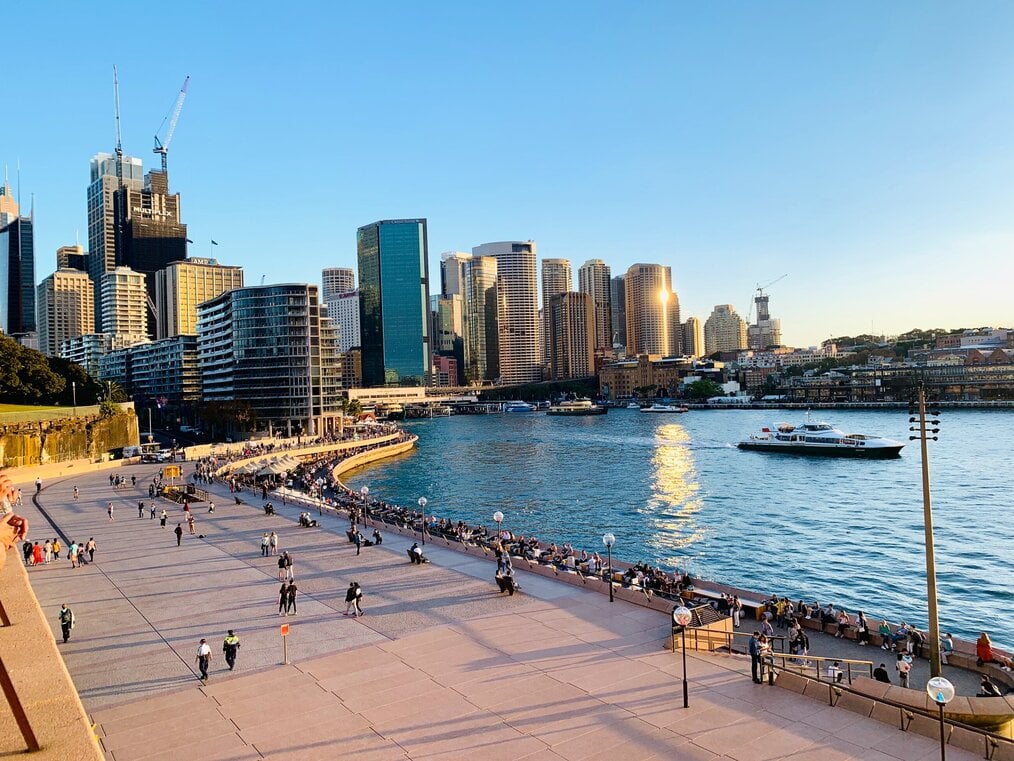 Photo by Jamar Cromwell on Unsplash A beach with a city in the background.