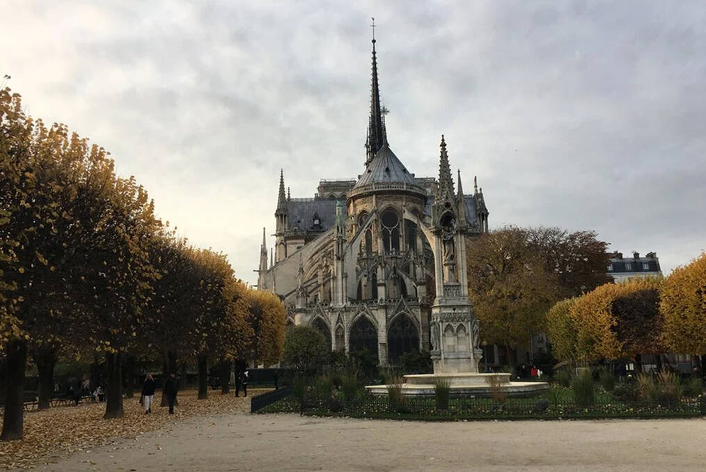 A castle with a sunset behind