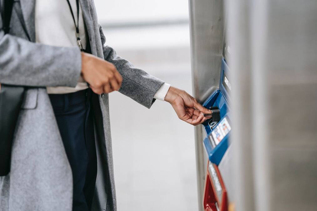 A student using an ATM with a card