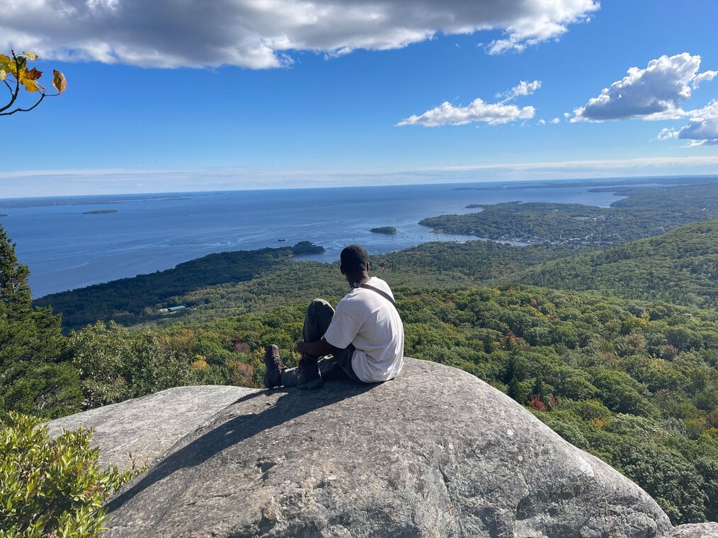 Good Life Gap Term in Maine, Maurice Sanders alum Maurice Sanders at the summit of a hike in Maine