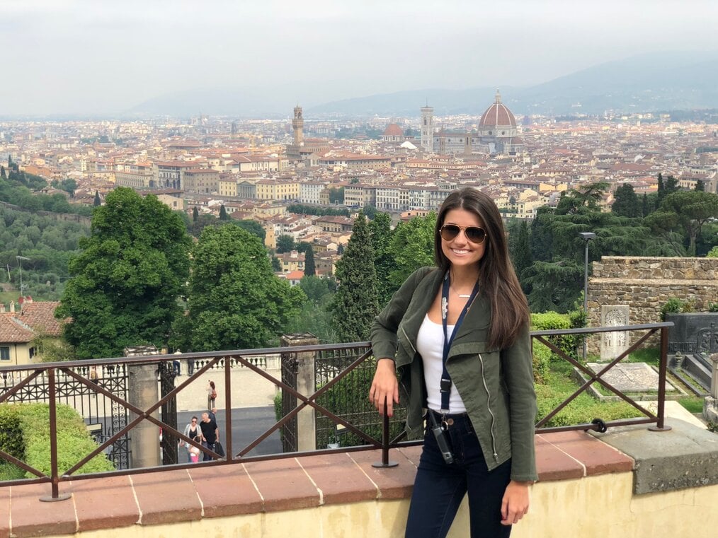 Student smiling overlooking city