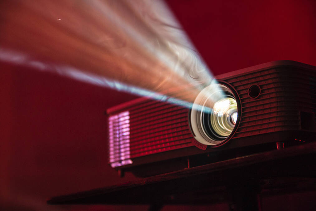 A projector playing a movie