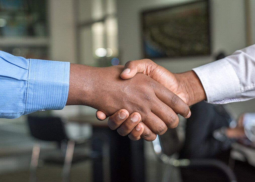 Photo by Cytonn Photography via Unsplash Two people shaking hands