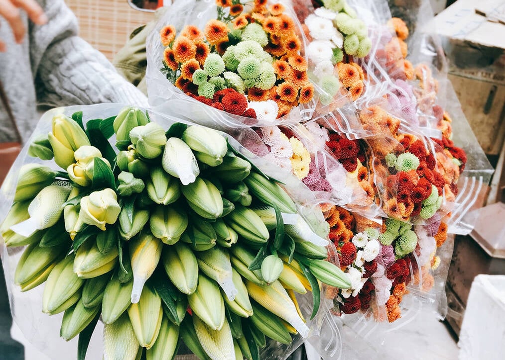 A bouquet of flowers getting delivered