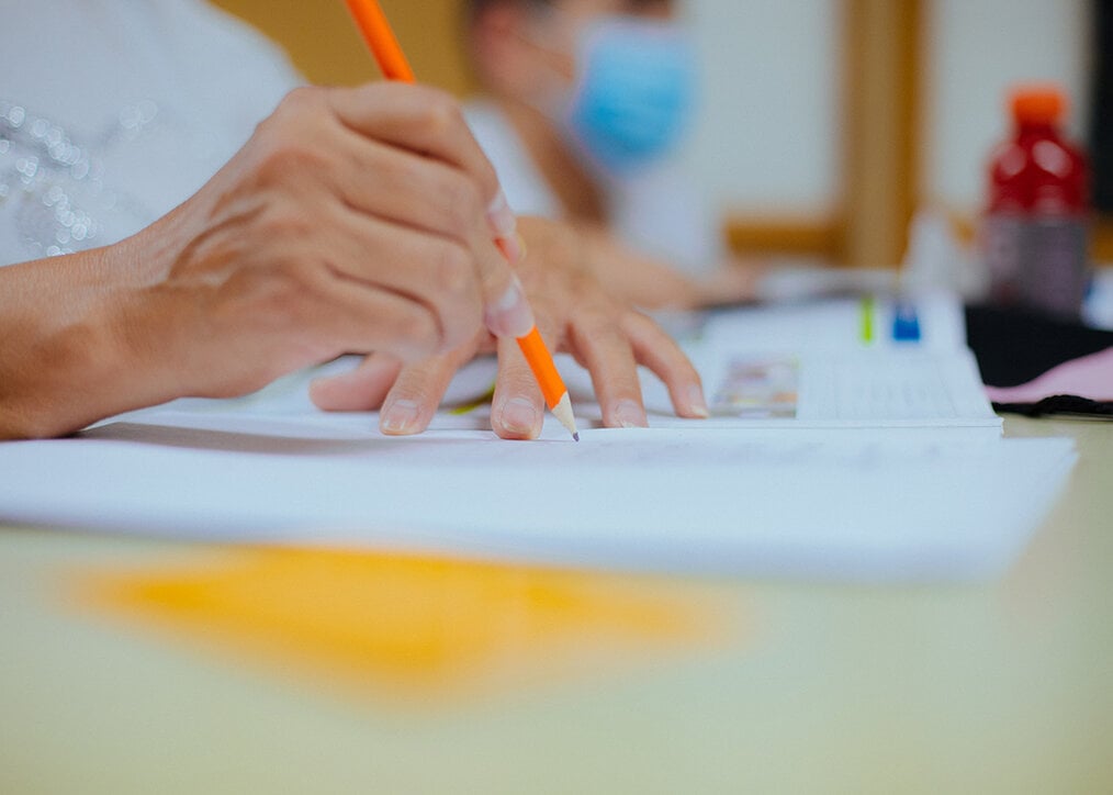 Photo by Kenny Eliason via Unsplash A teacher writing
