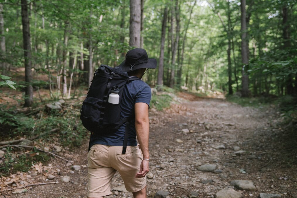 Person hiking through forest