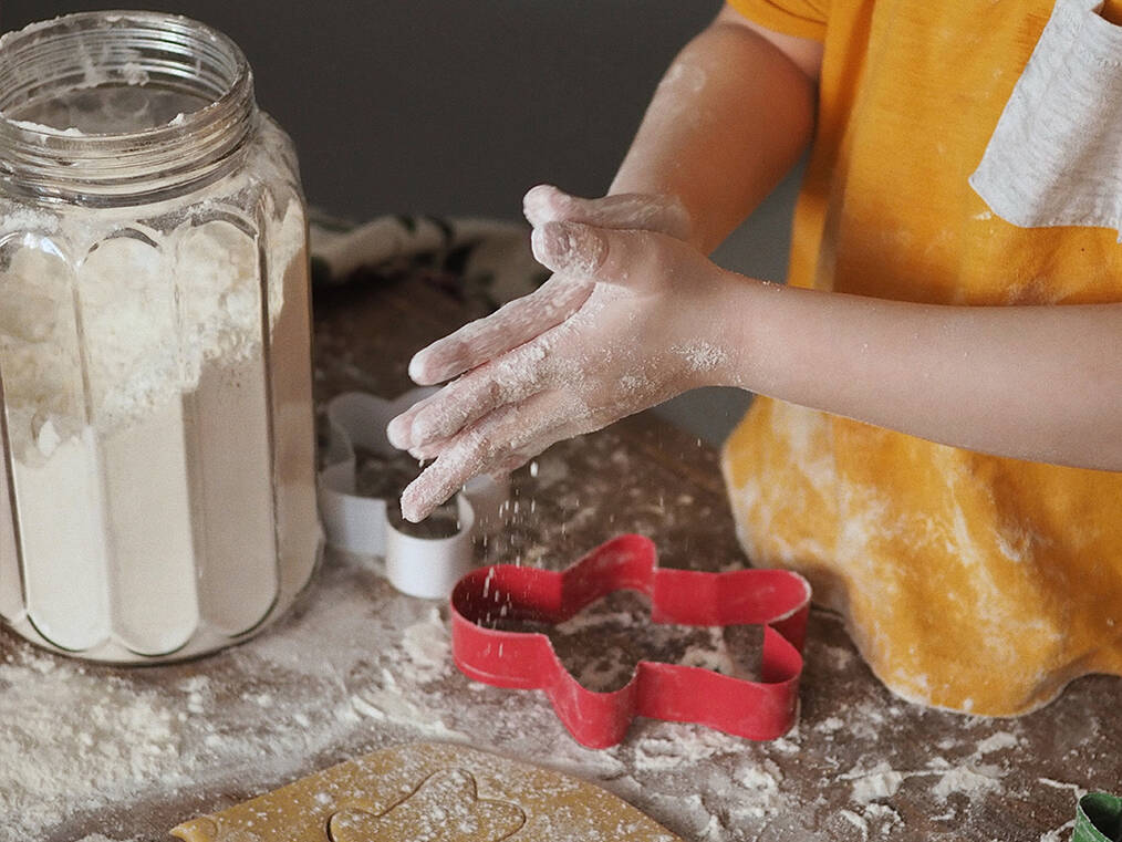 A child making ginger bread cookies